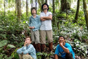 Seeing Orangutans in the wild with jungle guide Udin. Pictured, clockwise from back left, Tom, Chris, Udin and Kit.