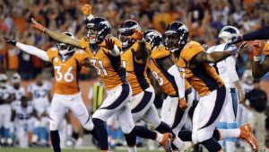 The Denver Broncos celebrate a missed game-winning field goal attempt by the Carolina Panthers during the second half of ...