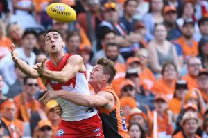 Xavier Richards, of the Swans, marks in front of Adam Tomlinson, of the Giants, during the first  qualifying final ...