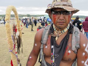 Jon Don Ilone Reed, an Army veteran and member of South Dakota's Cheyenne River Sioux Tribe, poses for a photo at an oil pipeline protest near the Standing Rock Sioux reservation in southern North Dakota on Thursday, Aug. 25, 2016.