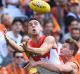 Xavier Richards, of the Swans, marks in front of Adam Tomlinson, of the Giants, during the first  qualifying final ...