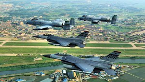 Osan Air Base : F-16 Falcons and A-10 Thunderbolt IIs fly over the Republic of Korea .