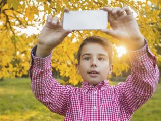 Boy takes selfie