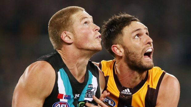 Port’s Tom Clurey and Hawk Jack Gunston battle it out at the Adelaide Oval.