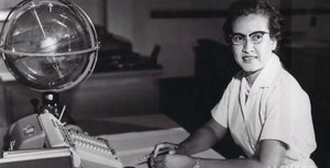 File - NASA research mathematician Katherine Johnson is photographed at her desk at NASA Langley Research Center with a globe, or "Celestial Training Device." Johnson began her career in 1953 at the National Advisory Committee for Aeronautics (NACA), the agency that preceded NASA, one of a number of African-American women hired to work as "computers" in what was then their Guidance and Navigation Department.