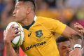 Shackled: Israel Folau attempts to break away from the Boks' defence.