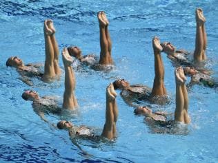 Team Australia competes in the Teams Technical Routine Final during the synchronised swimming event at the Maria Lenk Aquatics at the Rio 2016 Olympic Games in Rio de Janeiro on August 18, 2016. / AFP PHOTO / CHRISTOPHE SIMON