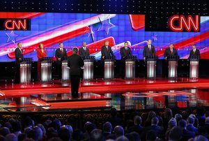 Republican presidential candidates, from left, John Kasich, Carly Fiorina, Marco Rubio, Ben Carson, Donald Trump, Ted Cruz, Jeb Bush, Chris Christie, and Rand Paul share the stage with debate moderator Wolf Blitzer during the CNN Republican presidential debate at the Venetian Hotel & Casino on Tuesday, Dec. 15, 2015, in Las Vegas.