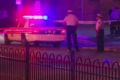 In this frame from video, police work at the scene of a shooting in Columbus, Ohio, where a boy with a BB gun was killed. 