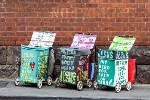 1. Three trolleys Jesus trolleys c. 2005?2010 enamel and acrylic paint on shopping trolley, acrylic paint on fabric, ...