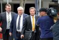 Clive Palmer arrives on Thursday at the Federal Court to answer questions regarding the fall of Queensland Nickel.