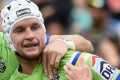 Green and gold: Jarrod Croker celebrates a try.