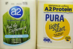 Bottles of milk from a2 and Pura, which both make A2 protein claims.