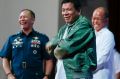 Philippines President Rodrigo Duterte wears a pilot's jacket presented to him during a visit to Air Force headquarters ...