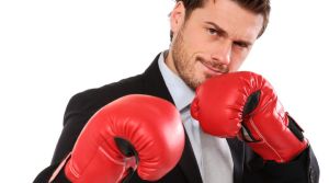 business man wearing boxing gloves ready for tough opposition , isolated on white background. ISTOCK Boxing Business ...