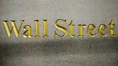 FILE - In this Oct. 8, 2014, file photo, a Wall Street address is carved in the side of a building in New York. European stock markets rose on solid economic data Tuesday, Aug. 23, 2016, while investors in Asia largely stayed on the sidelines ahead of a widely anticipated speech by the Fed chief. (AP Photo/Mark Lennihan, File)