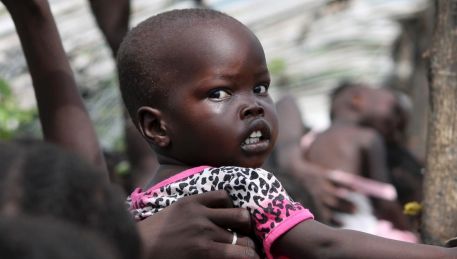 A baby in the queue for food at a camp for displaced people near the United Nations base in Juba, South Sudan. 