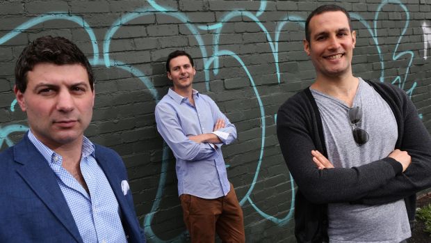 Bluethumb co-founder Ed Hartley is flanked by investors Adam Schwab, left and Jeremy Same.