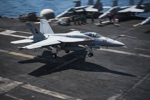 File - An F/A-18E Super Hornet assigned to the Sidewinders of Strike Fighter Squadron 86 makes an arrested landing on the flight deck of the aircraft carrier USS Dwight D. Eisenhower during Operation Inherent Resolve, Arabian Sea, 15 Sept, 2016.