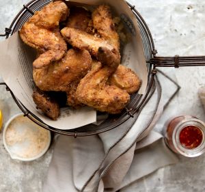 Buttermilk fried chicken with hot sauce.