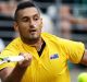 SYDNEY, AUSTRALIA - SEPTEMBER 16: Nick Kyrgios of Australia plays a forehand with his nose plugged due to a nose bleed ...