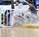 A man rides on a motorcycle in a flooded road after Typhoon Meranti  in Fuzhou.