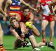 Adelaide’s Rory Sloane is tackled by Sydney’s Josh Kennedy during Saturday night’s semi-final at the SCG.