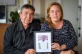 Karyn Ross and her father, Vince Ross, hold a photo of Leister.