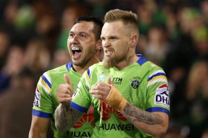 CANBERRA, AUSTRALIA - SEPTEMBER 17: Jordan Rapana of the Raiders celebrates scoring a try with team mate Blake Austin ...