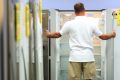 Buying the fridge rather than the food: A shopper looks at refrigerators at a Harvey Norman store in Sydney.