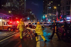 Police and firefighters work near to the scene in Manhattan, New York, Saturday, Sept. 17, 2016.