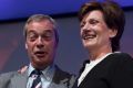 Outgoing UKIP leader Nigel Farage congratulates MEP Diane James after she was announced as the new leader of UKIP.