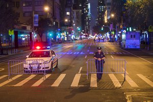 Police stand guard as the cordon Sixth Avenue near the scene of Saturday's explosion on West 23rd Street and Sixth Avenue in Manhattan's Chelsea neighborhood, New York, Sunday, Sept. 18, 2016.