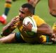 Will Genia crosses for a try with Argentina's Tomas Cubelli in pursuit in Perth on Saturday.