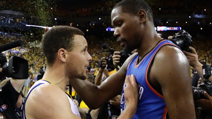 OAKLAND, CA - MAY 30: Stephen Curry #30 of the Golden State Warriors speaks with Kevin Durant #35 of the Oklahoma City Thunder after their 96-88 win in Game Seven of the Western Conference Finals during the 2016 NBA Playoffs at ORACLE Arena on May 30, 2016 in Oakland, California. NOTE TO USER: User expressly acknowledges and agrees that, by downloading and or using this photograph, User is consenting to the terms and conditions of the Getty Images License Agreement. (Photo by Ezra Shaw/Getty Images)