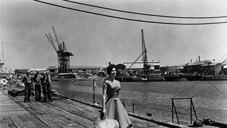 Actress Ava Gardner as Moira Davidson walks along a wharf in the Port of Melbourne in 1959.