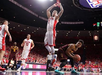 Arizona State guard Tra Holder (0) is defended by Arizona guard Gabe York (1) during the first half of an NCAA college basketball game Wednesday, Feb. 17, 2016, in Tucson, Ariz. (Source: AP Photo/Chris Coduto)