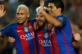 Deadly trio: Barcelona's Lionel Messi, centre, celebrates with  teammates Luis Suarez, right, and Neymar.