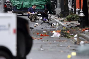 Evidence teams investigate at the scene of Saturday's explosion on West 23rd Street in Manhattan's Chelsea neighborhood, Monday, Sept. 19, 2016, in New York. Ahmad Khan Rahami, wanted in the bombings that rocked Chelsea and a New Jersey shore town was captured Monday.