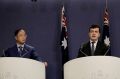 Yuhu Group chief executive Huang Xiangmo and Sam Dastyari at a press conference for the Chinese community in Sydney in June.