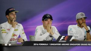 Race winner Nico Rosberg, centre, sits with Daniel Ricciardo, left, and Lewis Hamilton.