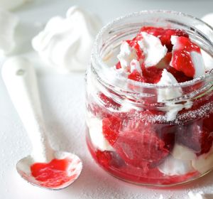 Eton mess with strawberry sauce.