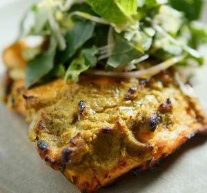 MELBOURNE, AUSTRALIA - AUGUST 18: The Tandoori salmon with mint and wombok salad prepared by Chef Adam D'Sylva served at ...