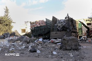 This image provided by the Syrian anti-government group Aleppo 24 news, shows damaged trucks carrying aid, in Aleppo, Syria, Tuesday, Sept. 20, 2016.