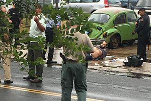 Ahmad Khan Rahami is taken into custody after a shootout with police Monday, Sept. 19, 2016, in Linden, N.J. Rahami was wanted for questioning in the bombings that rocked the Chelsea neighborhood of New York and the New Jersey shore town of Seaside Park.