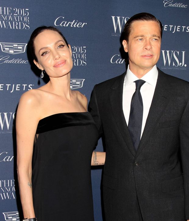 Happier times: Angelina Jolie Pitt, left, and Brad Pitt in 2015. 