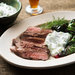 Lebanese lamb steak with seven-spice mixture, yogurt sauce and wilted Swiss chard.