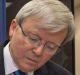 Papua New Guinea's Prime Minister Peter O'Neill and Kevin Rudd sign an agreement over asylum seekers in July 2013.