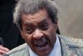 Republican presidential candidate Donald Trump applauds as he is introduced by boxing promoter Don King.