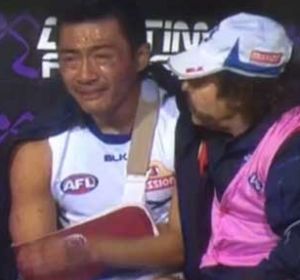 That was then: A devastated Lin Jong on the bench after breaking his collarbone.